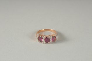 A 10K GOLD RUBY AND DIAMOND RING.