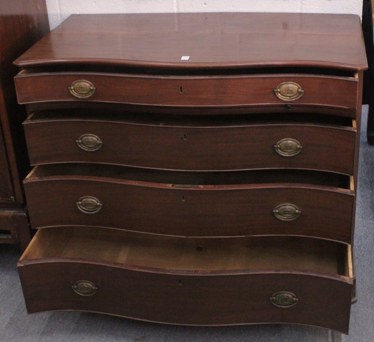 A GOOD GEORGE III MAHOGANY SERPENTINE FRONTED COMMODE with four long graduated drawers with brass - Image 2 of 2