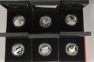 THE SHENGXIAO COLLECTION, ONE OUNCE COINS. Years of: THE ROOSTER, THE DOG, THE PIG, THE SHEEP THE