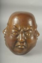 A BRONZE FOUR FACED BUDDHA. 8ins high.