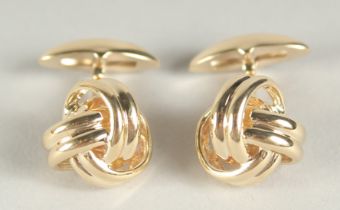 A PAIR OF 9CT GOLD KNOT SWIVEL CUFF LINKS in a box.