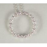 AN 18CT WHITE GOLD DIAMOND SET CIRCLE OF LIFE PENDANT AND CHAIN in a box.