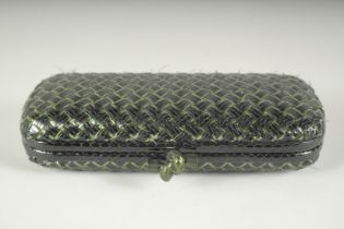 BOTTEGA VENETO. A BLACK AND GILT WOVEN CLUTCH BAG. 9.5ins long.