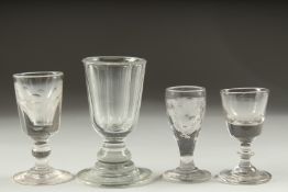FOUR VARIOUS HEAVY GLASSES.