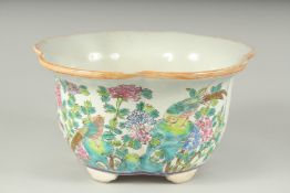 A BOWL PAINTED WITH BIRDS AND FLOWERS. 9ins diameter.