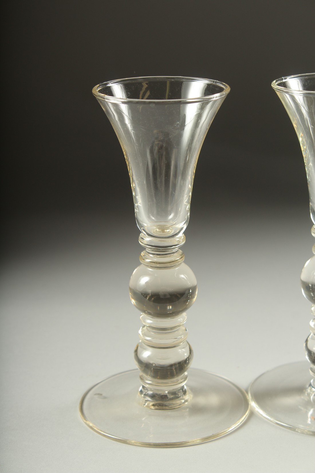 A SET OF FOUR PLAIN KNOP STEM WINE GLASSES. 7ins high. - Image 2 of 5