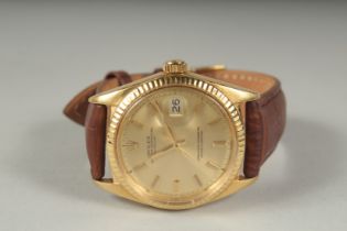 A GENTLEMAN'S 18CT GOLD ROLEX DATE JUST WRISTWATCH. Model 1601, serial no. 3091052 with black