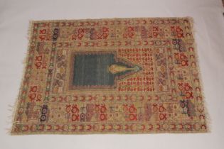A PERSIAN PRAYER RUG, beige ground with stylised borders. 5ft 10ins x 4ft 4ins.