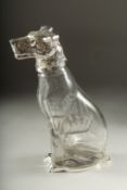 A GLASS CLARET JUG formed as a dog with silver plated head. 8ins high.