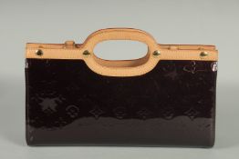 A GOOD LOUIS VUITTON BLACK PATENT LEATHER HAND BAG with beige handles. 13ins long, 7ins high, 3.5ins