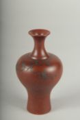A SMALL CHINESE POTTERY VASE.