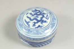 A CHINESE BLUE AND WHITE CIRCULAR DRAGON BOX AND COVER ,six character mark. 5ins diameter.