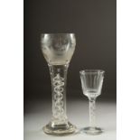 A LARGE OPAQUE TWIST WINE GLASS, the bowl engraved with a sporting dog .9ins high and a small wine