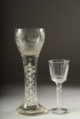 A LARGE OPAQUE TWIST WINE GLASS, the bowl engraved with a sporting dog .9ins high and a small wine