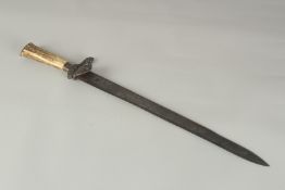 A GERMAN KNIFE with 13ins engraved blade, bone handle, in a leather sheath.