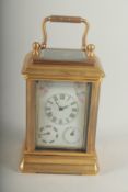 A MINIATURE CARRIAGE CLOCK with Sevres panel. 8cm high.