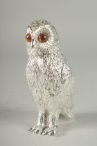 A SILVER PLATED OWL SUGAR SIFTER with glass eyes. 6ins high.