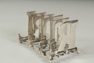 A SILVER PLATED LETTER TOAST RACK.