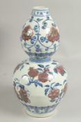 A CHINESE DOUBLE GOURD VASE painted with fruit. 12ins high.