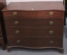 A GOOD GEORGE III MAHOGANY SERPENTINE FRONTED COMMODE with four long graduated drawers with brass