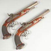 A PAIR OF PERCUSSION CAP PISTOLS, OCTAGONAL BARRELS, MAHOGANY STOCK with silver butt, both with