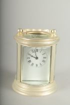 A SMALL ROUND SILVER CARRIAGE CLOCK. 7cm high.