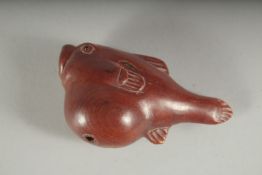 A JAPANESE CARVED WOOD FISH, signed, 2.25ins long.