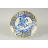 A CANTAGALLI ITALIAN POTTERY CIRCULAR CHARGER. The centre with a man on horseback in blue. 14ins