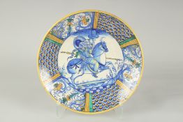 A CANTAGALLI ITALIAN POTTERY CIRCULAR CHARGER. The centre with a man on horseback in blue. 14ins