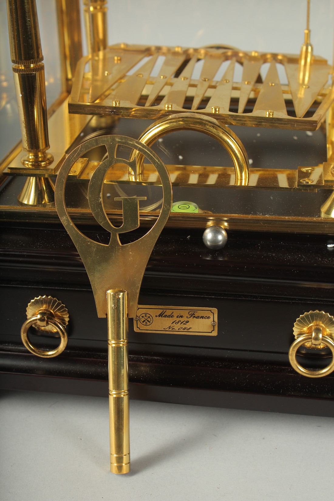 A GOOD ROLLING BALL CLOCK with three dials in a glass case. 16ins high overall. - Image 2 of 4