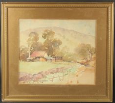 William Oates (1862-1945) Australian, Farm buildings beneath a large mountain, watercolour, signed