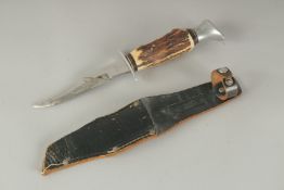 A SOLINGER GERMAN KNIFE with 4.5ins blade and bone handle, in a leather sheath.