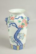 A CHINESE VASE painted with a flowering tree design, six character mark. 9ins high.