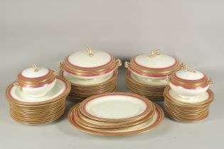 A MAPLE OF LONDON PORCELAIN DINNER SERVICE with blue and gilt border comprising two circular