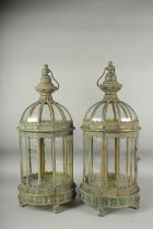 A PAIR OF METAL CIRCULAR LANTERNS with ring handles. 26ins high.