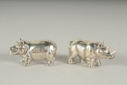 A PAIR OF SILVER HIPPO AND RHINOS.