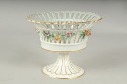 A DRESDON CIRCULAR COMPORT painted with flowers.