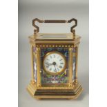 AN OCTAGONAL BRASS AND ENAMEL CARRIAGE CLOCK with column sides. 5ins high.