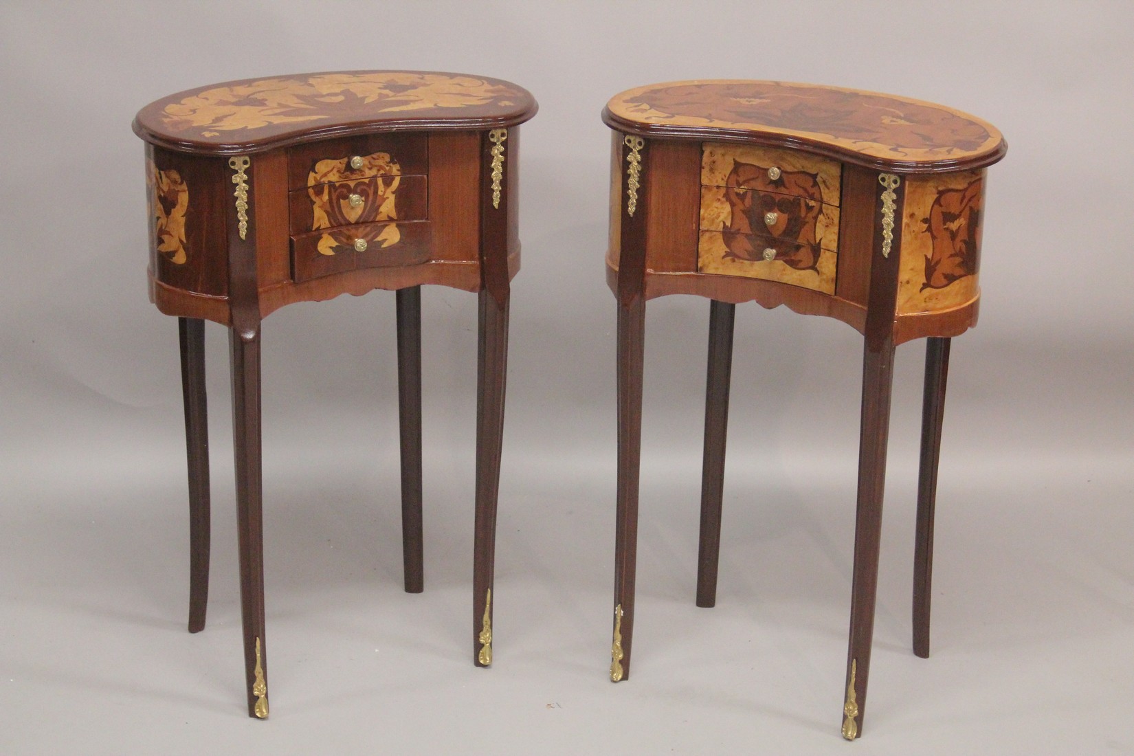 A GOOD PAIR OF LOUIS XVITH STYLE, INLAID KIDNEY SHAPED BEDSIDE CABINET with three drawers. 1ft
