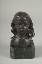 A SMALL BRONZE BUST OF A YOUNG GIRL. Signed, 4ins on a marble base.