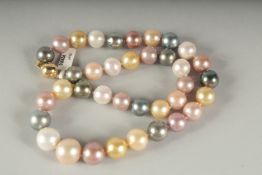 A SUPERB STING OF 38 SOUTH SEAS TAHITAN PEARLS with 18ct gold clasp, in a fitted box.