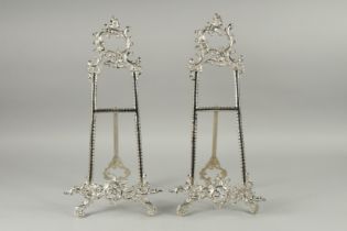 A PAIR OF SILVER PLATED PICTURE EASLES. 20ins high.