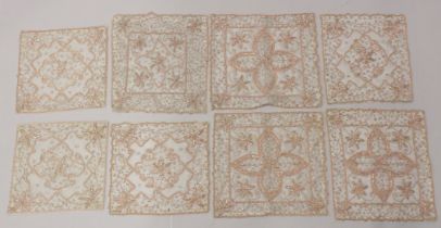 EIGHT METAL THREAD EMBROIDERED SQUARES.