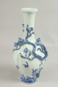 A CHINESE BLUE AND WHITE PEACH VASE with peaches in relief, square blue mark. 12ins high.