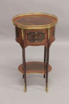 A LOUIS XVITH STYLE OVAL BEDSIDE CABINET with brass gallery and three drawers. 1ft 4ins wide x 2ft