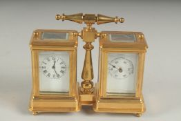 A DOUBLE BRASS CARRIAGE CLOCK AND BAROMETER with carrying handle. 9cms high.