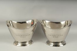 A PAIR OF CHAMPAGNE OVAL TWO HANDLED BOTTLE COOLERS. 13ins long x 10ins high.