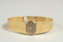 A GIRARD PERREGAUX LADIES 18CT GOLD WRISTWATCH, with leather strap, with original box.