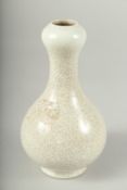 A SMALL CHINESE CRACKLE GLAZE VASE. 6.5ins high.