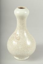 A SMALL CHINESE CRACKLE GLAZE VASE. 6.5ins high.